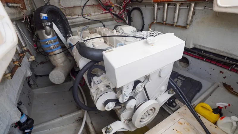  Yacht Photos Pics Engine compartment of a 2006 SeaVee 34 CC boat, showcasing mechanical components and wiring.