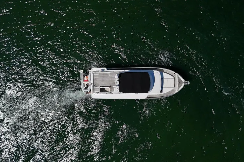 Balena Yacht Photos Pics Overhead view of 2015 Beneteau Swift Trawler 50 cruising on open water.