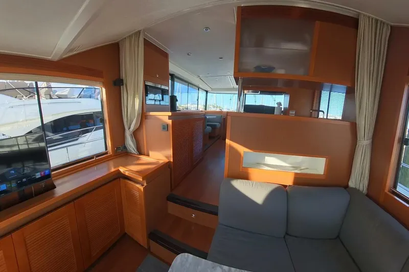 Balena Yacht Photos Pics Interior of 2015 Beneteau Swift Trawler 50, featuring wood finishes and modern furnishings.