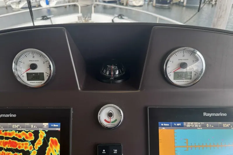 Balena Yacht Photos Pics Dashboard of 2015 Beneteau Swift Trawler 50 with gauges and Raymarine displays.