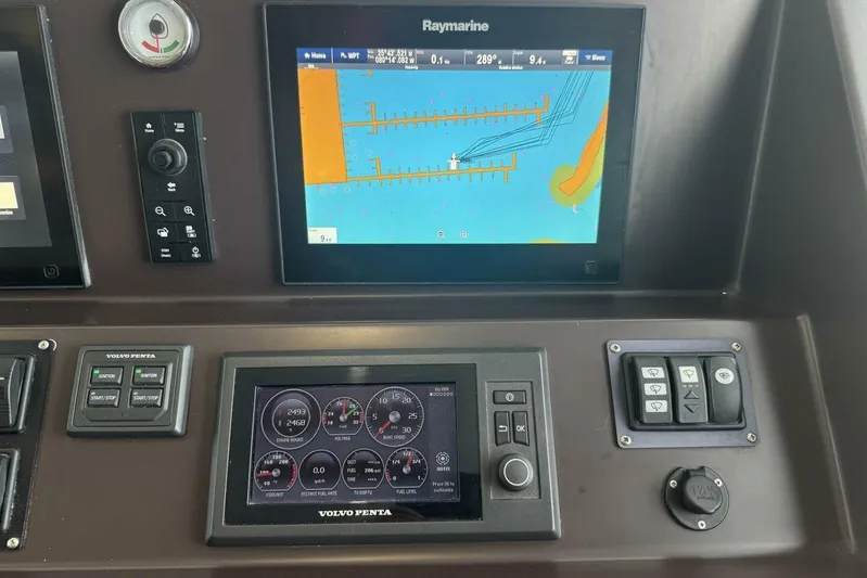 Balena Yacht Photos Pics Control panel of 2015 Beneteau Swift Trawler 50 with navigation and engine displays.
