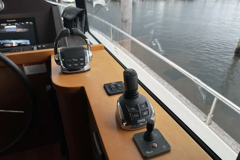 Balena Yacht Photos Pics Control panel of a 2015 Beneteau Swift Trawler 50 with joystick and throttle.