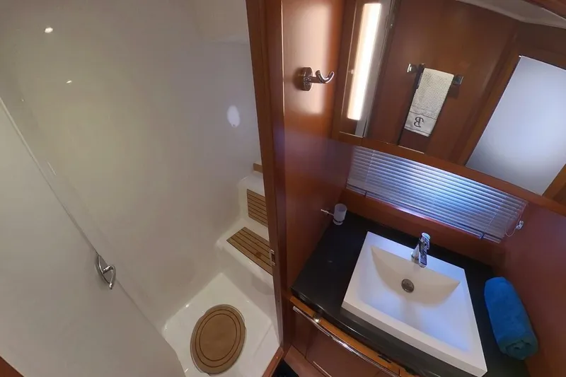 Balena Yacht Photos Pics Bathroom interior of 2015 Beneteau Swift Trawler 50 with modern sink and shower.