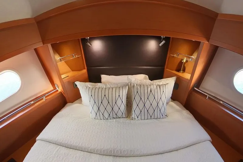 Balena Yacht Photos Pics Luxurious bedroom interior of 2015 Beneteau Swift Trawler 50 yacht with elegant bedding.