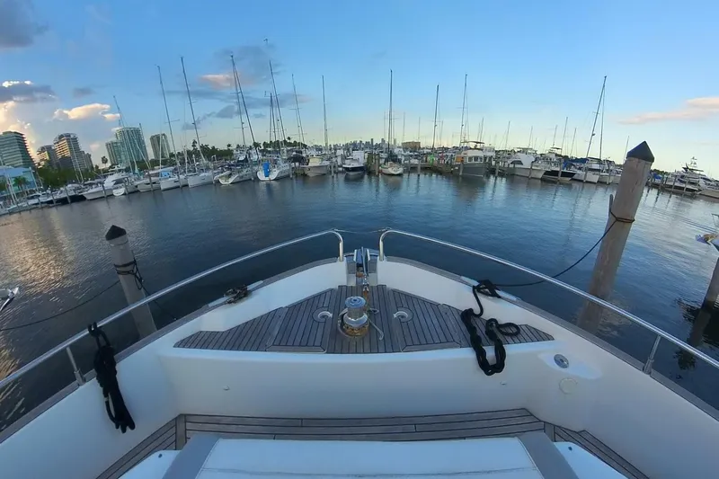 Balena Yacht Photos Pics Bow view of a 2015 Beneteau Swift Trawler 50 docked in a marina.