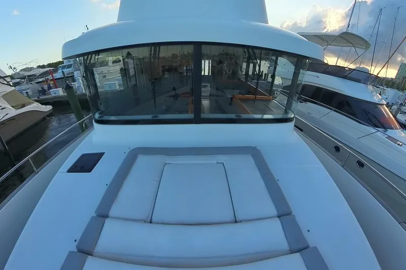 Balena Yacht Photos Pics 2015 Beneteau Swift Trawler 50 docked, showcasing spacious deck and modern design.