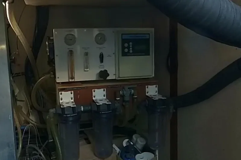 Balena Yacht Photos Pics Engine room of 2015 Beneteau Swift Trawler 50 with filtration system and control panel.