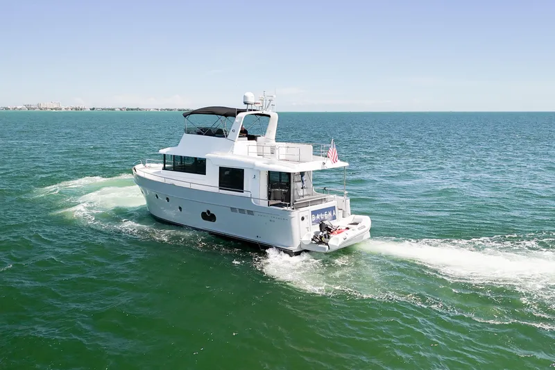 Balena Yacht Photos Pics 2015 Beneteau Swift Trawler 50 cruising on open sea under clear skies.