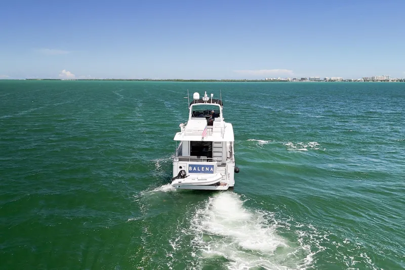 Balena Yacht Photos Pics 2015 Beneteau Swift Trawler 50 cruising on open water under clear skies.