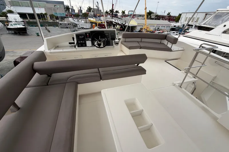  Yacht Photos Pics 2016 Leopard 51 Powercat yacht interior with seating and helm station.