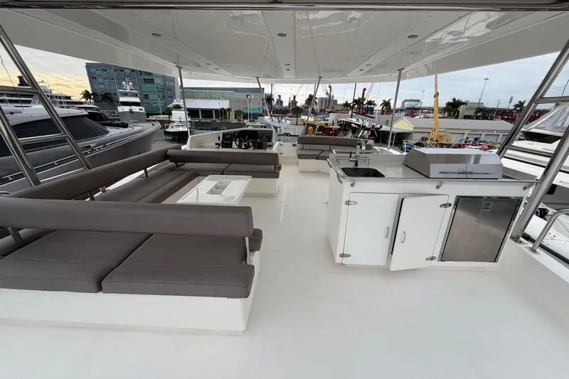  Yacht Photos Pics Spacious deck of 2016 Leopard 51 Powercat with seating and kitchenette.