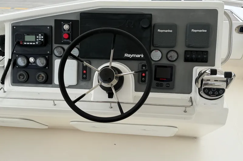  Yacht Photos Pics Helm of 2016 Leopard 51 Powercat with Raymarine navigation equipment and steering wheel.