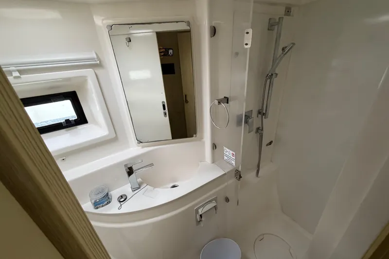  Yacht Photos Pics Bathroom interior of 2016 Leopard 51 Powercat yacht, featuring shower and sink.