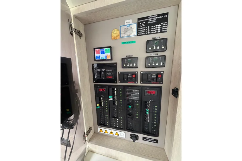  Yacht Photos Pics Electrical control panel of 2016 Leopard 51 Powercat yacht, featuring various switches and displays.