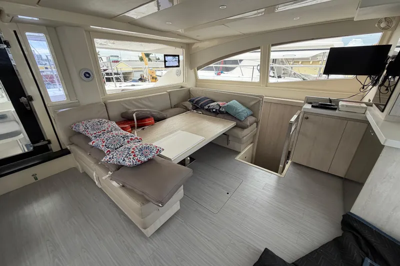  Yacht Photos Pics Interior of 2016 Leopard 51 Powercat with cozy seating, cushions, and modern decor.