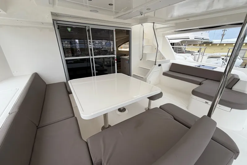  Yacht Photos Pics Spacious interior of 2016 Leopard 51 Powercat with modern seating and table.