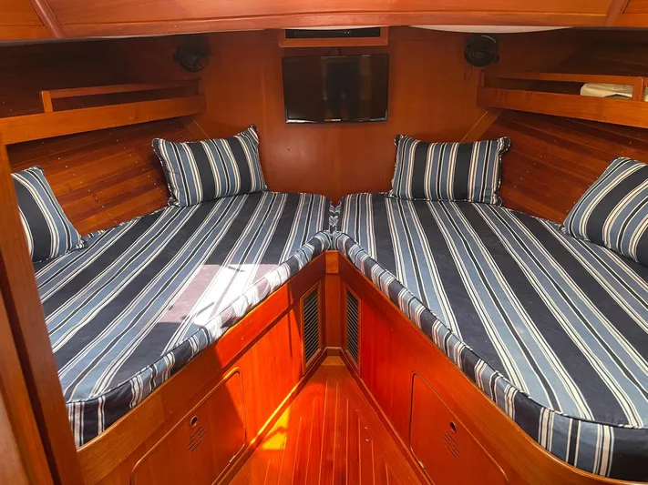 Southerly Yacht Photos Pics Cozy cabin interior of 1990 Lyman-Morse 52 yacht with striped bedding.