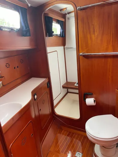 Southerly Yacht Photos Pics Luxurious wooden bathroom interior of 1990 Lyman-Morse 52 yacht.