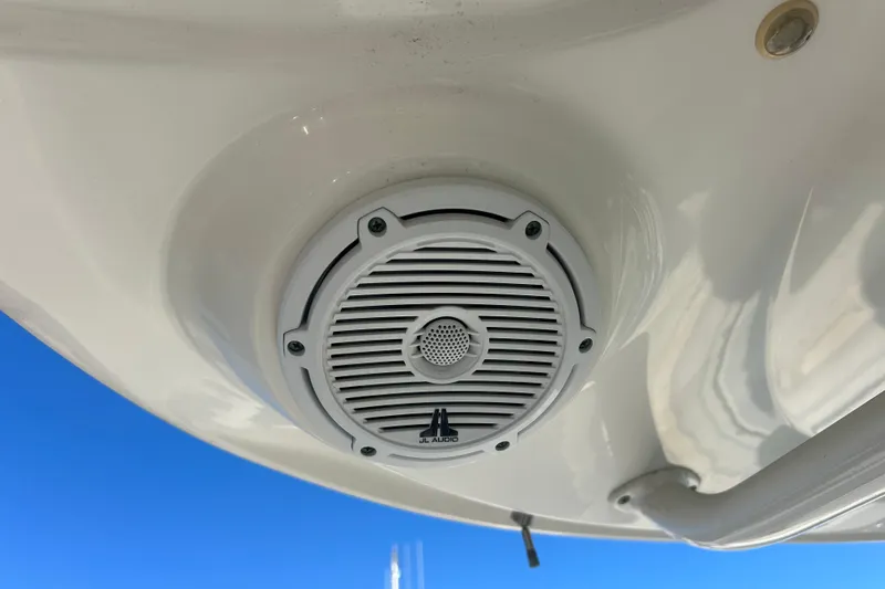 Tt Virtue Yacht Photos Pics JL Audio speaker on 2012 Boston Whaler 370 Outrage boat, under clear blue sky.