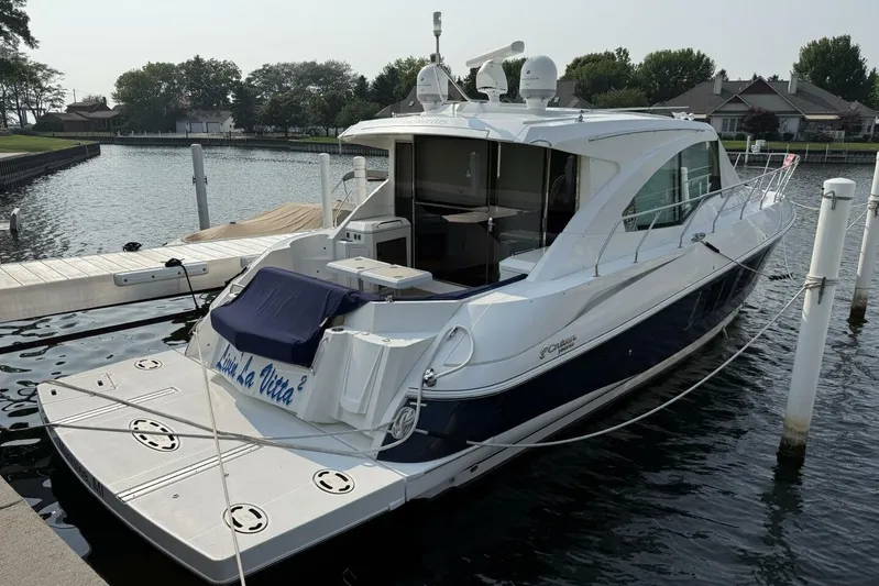  Yacht Photos Pics 2013 Cruisers Yachts Cantius docked at marina, sleek design, luxury motor yacht.