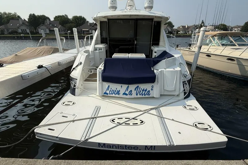  Yacht Photos Pics 2013 Cruisers Yachts Cantius docked in Manistee, Michigan, with "Livin' La Vitta" on the stern.