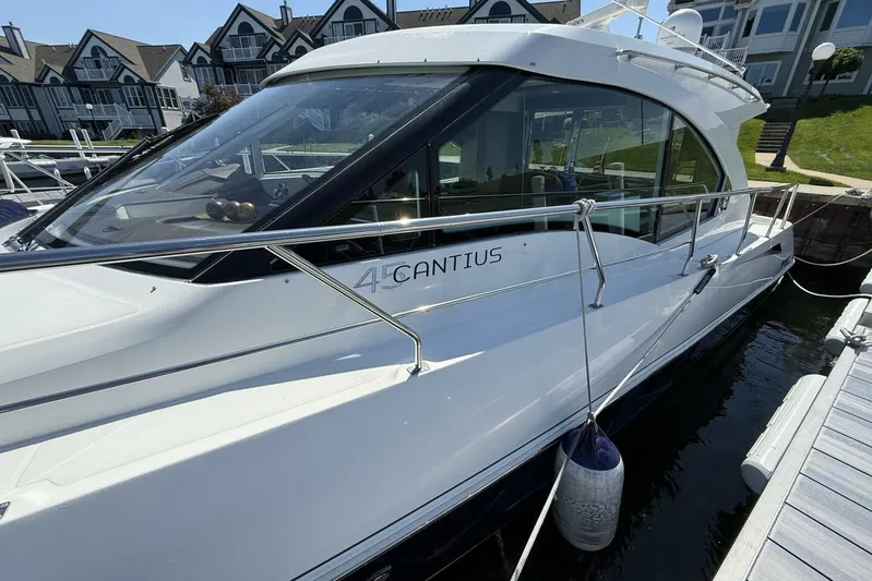  Yacht Photos Pics 2013 Cruisers Yachts Cantius docked, showcasing sleek design and modern architecture.