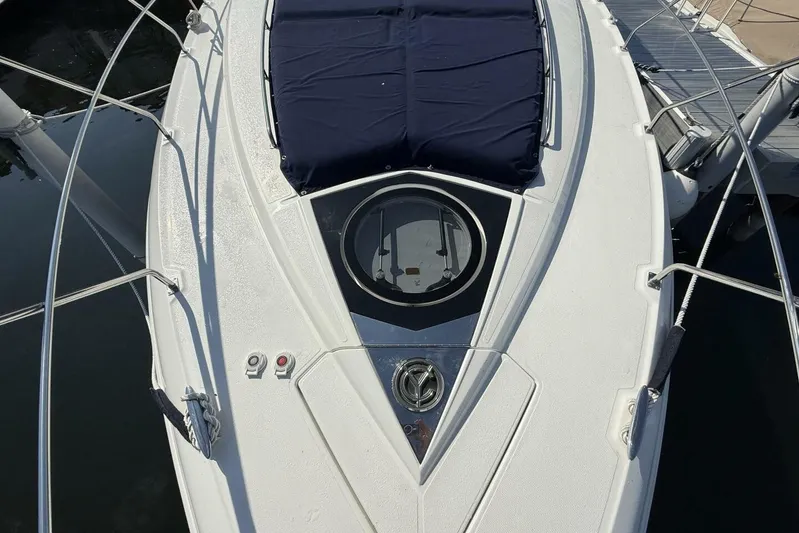  Yacht Photos Pics 2013 Cruisers Yachts Cantius deck with hatch and railing, docked at marina.