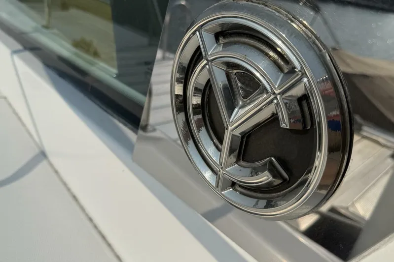  Yacht Photos Pics 2013 Cruisers Yachts Cantius emblem on a sleek, modern yacht exterior.