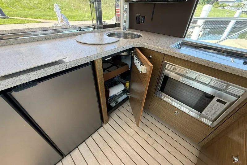  Yacht Photos Pics 2013 Cruisers Yachts Cantius kitchen with modern appliances and sleek countertops.