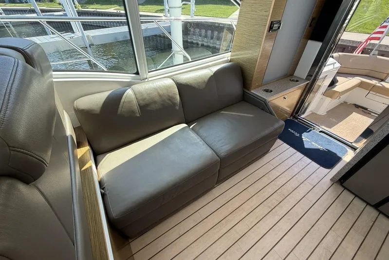  Yacht Photos Pics 2013 Cruisers Yachts Cantius interior with leather seating and wooden flooring.