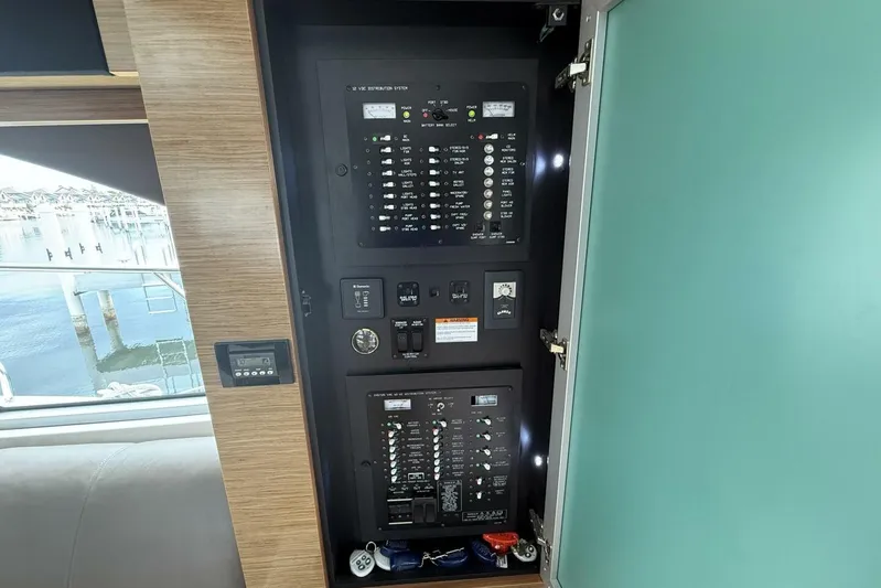  Yacht Photos Pics Electrical panel inside 2013 Cruisers Yachts Cantius, showcasing control systems and switches.