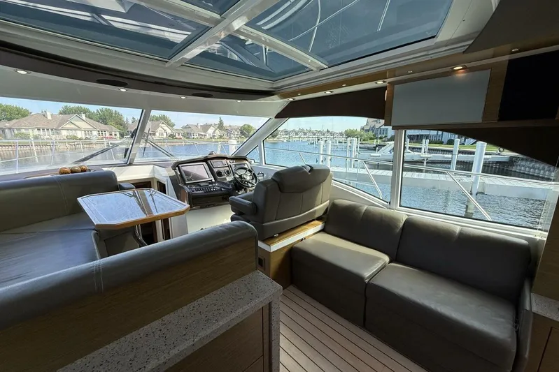  Yacht Photos Pics Luxurious 2013 Cruisers Yachts Cantius interior with spacious seating and panoramic windows.