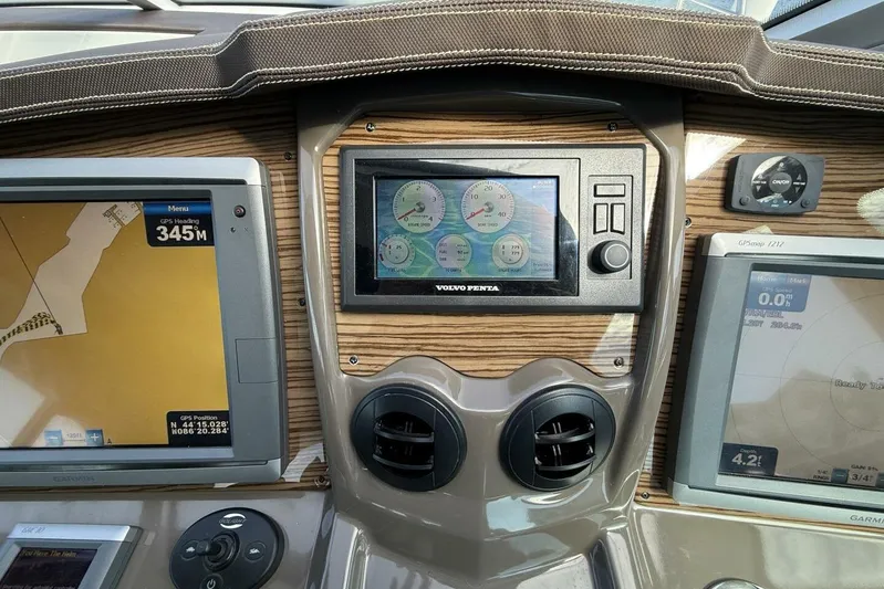  Yacht Photos Pics 2013 Cruisers Yachts Cantius dashboard with navigation and control screens.