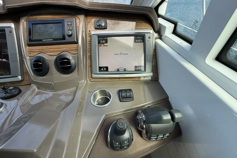  Yacht Photos Pics 2013 Cruisers Yachts Cantius helm with navigation screens and controls.