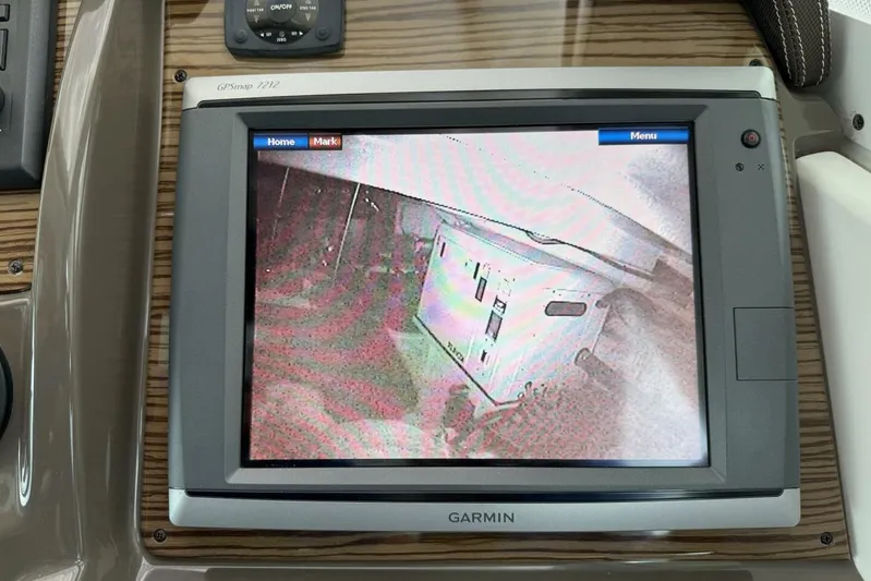  Yacht Photos Pics Garmin GPS display on 2013 Cruisers Yachts Cantius dashboard, showing camera feed.