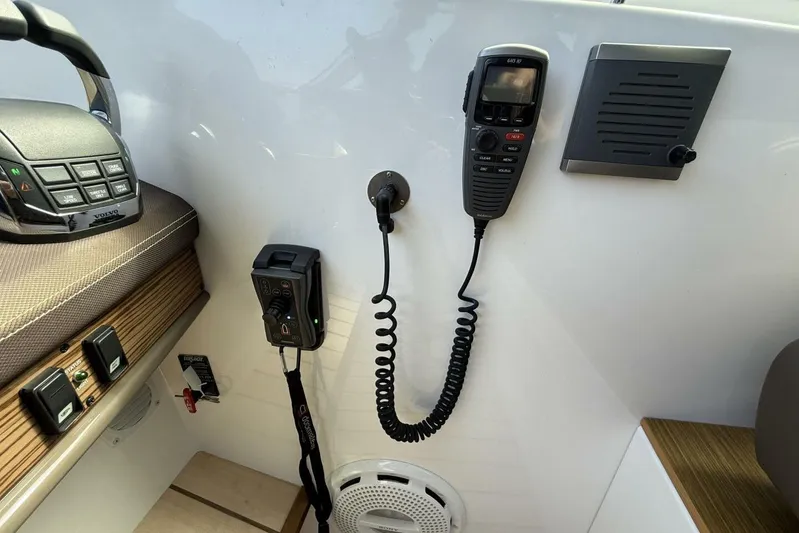  Yacht Photos Pics Control panel of 2013 Cruisers Yachts Cantius with communication devices and controls.