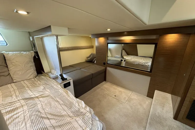  Yacht Photos Pics Luxurious 2013 Cruisers Yachts Cantius cabin interior with modern bedding and elegant wood finishes.