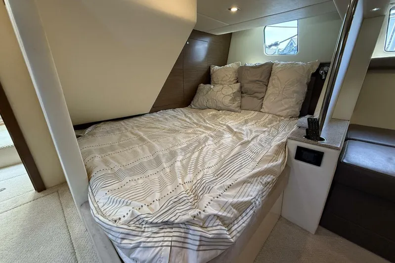  Yacht Photos Pics Cozy bedroom in 2013 Cruisers Yachts Cantius with plush bedding and modern design.