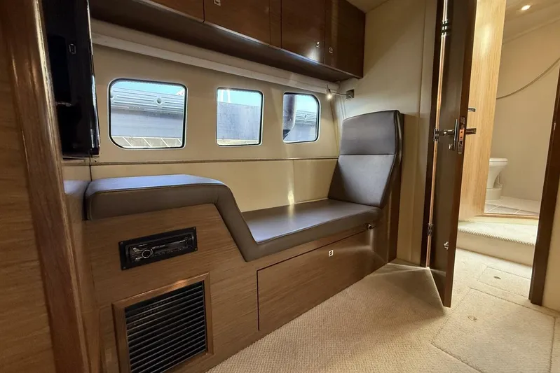  Yacht Photos Pics 2013 Cruisers Yachts Cantius interior with seating, windows, and bathroom view.