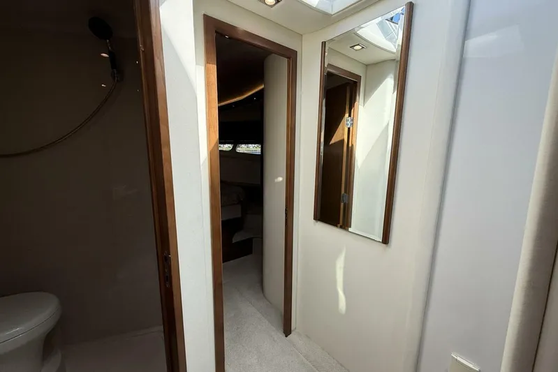  Yacht Photos Pics 2013 Cruisers Yachts Cantius interior with bathroom and hallway mirror.