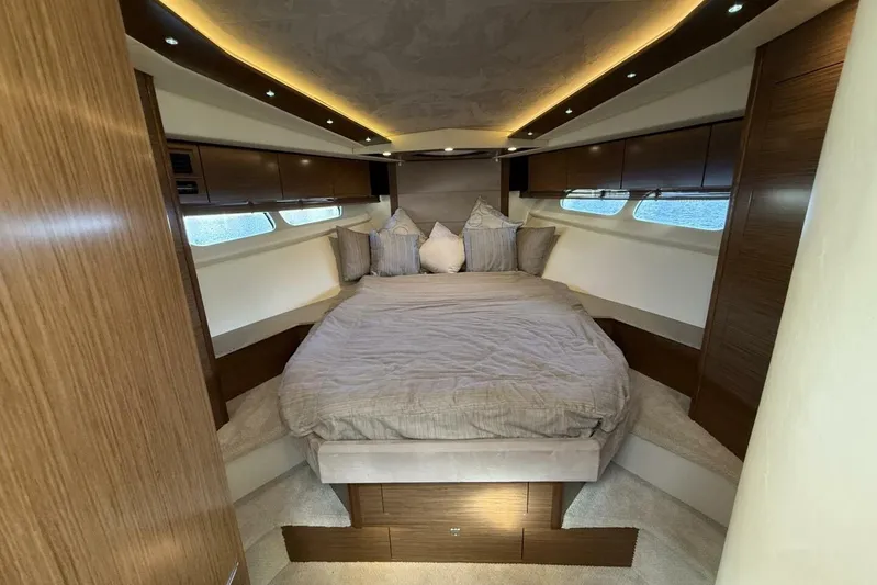  Yacht Photos Pics Luxurious 2013 Cruisers Yachts Cantius bedroom with elegant wood finish and ambient lighting.