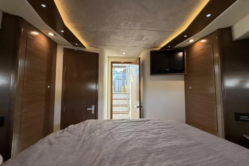  Yacht Photos Pics Luxurious interior of 2013 Cruisers Yachts Cantius with modern wood paneling and ambient lighting.