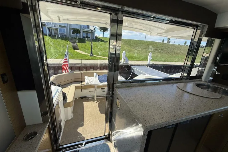  Yacht Photos Pics Interior view of 2013 Cruisers Yachts Cantius, featuring a spacious deck and seating area.