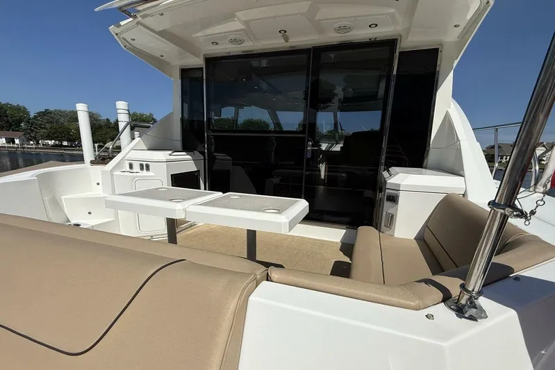  Yacht Photos Pics 2013 Cruisers Yachts Cantius with spacious outdoor seating and sleek design.