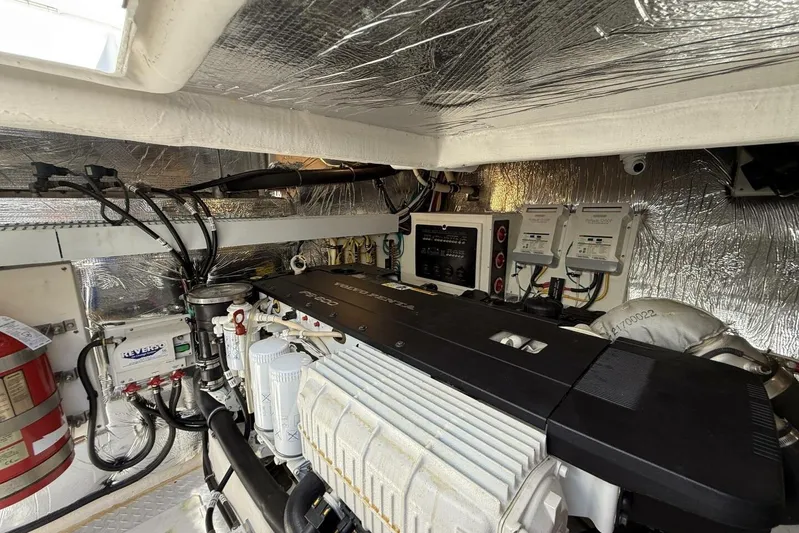  Yacht Photos Pics Engine room of 2013 Cruisers Yachts Cantius, featuring modern equipment and wiring.