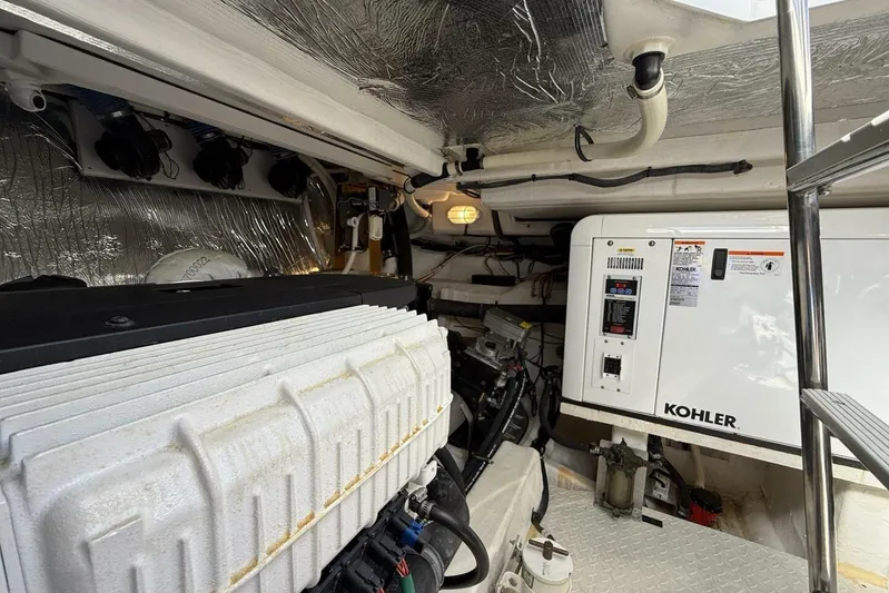  Yacht Photos Pics Engine room of 2013 Cruisers Yachts Cantius with Kohler generator and metallic insulation.