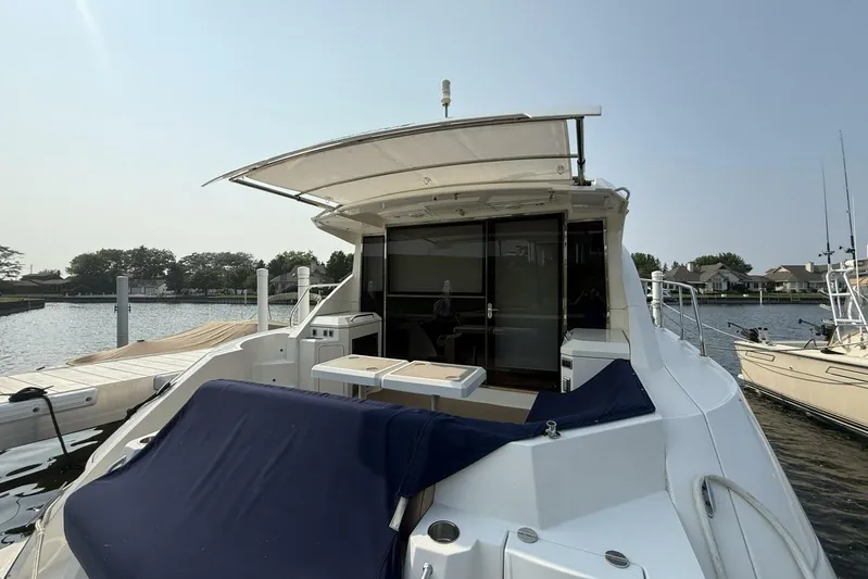  Yacht Photos Pics 2013 Cruisers Yachts Cantius docked, featuring spacious deck and modern design.