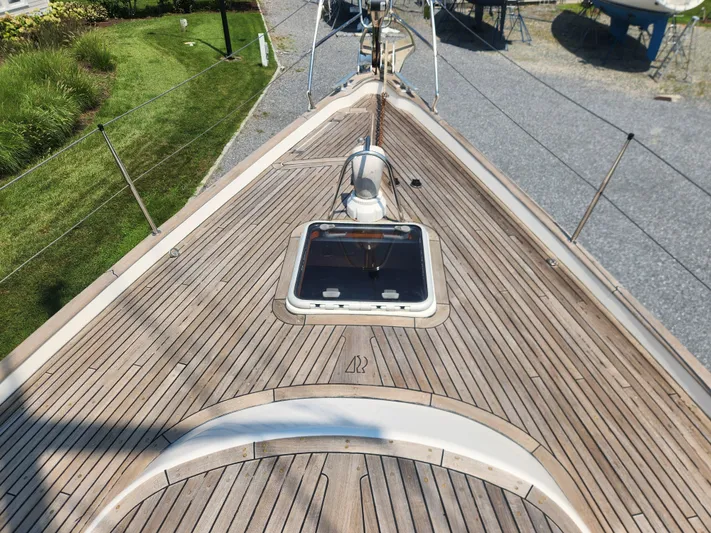 Sonder Yacht Photos Pics Deck of 2003 Hallberg-Rassy 46 sailboat with wooden finish and hatch.