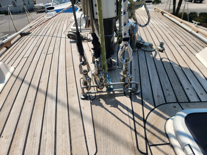 Sonder Yacht Photos Pics Deck of 2003 Hallberg-Rassy 46 sailboat with rigging and teak wood finish.