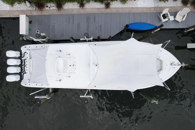  Yacht Photos Pics Aerial view of 2009 Yellowfin 42 Offshore boat docked with canopy cover.